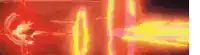 a close up of a red and yellow neon sign with a person standing in the background .