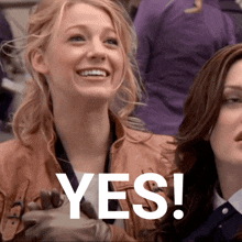 a woman in a brown jacket is smiling with the word yes written in white