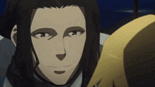 a man with long black hair looks at another man with blonde hair