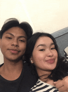 a man and a woman posing for a picture together