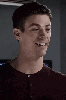 a close up of a man 's face with a smile on it .