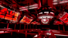 a room with a lot of red lights and a sign that says ' raw ' on it