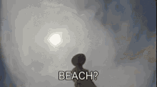 a silhouette of a person standing on a beach with the words `` beach ? '' written on it .