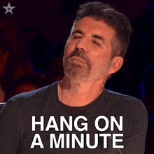 Hang On A Minute Simon Cowell GIF - Hang On A Minute Simon Cowell Britains Got Talent GIFs