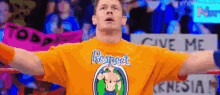 a man wearing a yellow shirt that says respect is holding a sign that says give me
