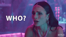 a woman with a necklace is asking who