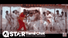 a group of people are dancing in front of a star tamil chat sign