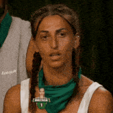 a woman wearing a green bandana with the name anastasia on it .