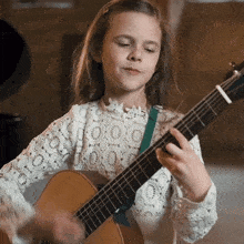Strumming The Guitar Claire Crosby GIF - Strumming The Guitar Claire Crosby The Crosbys GIFs