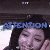 a video of a girl with the words attention on her head
