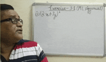 a man wearing glasses stands in front of a whiteboard that says exercise 3 + 1