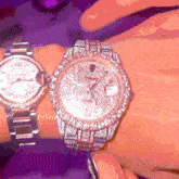 two watches on a woman 's wrist one of which says xii on the face