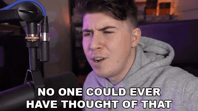 a man sitting in front of a microphone with the words no one could ever have thought of that