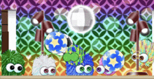 a bunch of balls with stars on them are sitting on a table