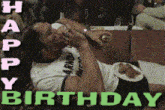 a birthday card with a man laying down and the words happy birthday