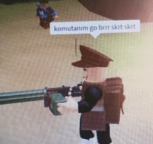 a cartoon character is holding a gun with a speech bubble that says komutanim go brrr skrt skrt .