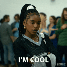 a woman says i 'm cool while holding a white bag