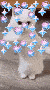 a cat is surrounded by pink and blue diamonds