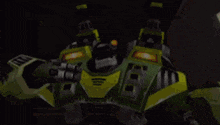 a video game scene with a green and yellow robot and a red robot