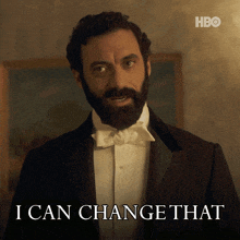 a man with a beard in a tuxedo says " i can change that "