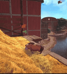 a cartoon pig is standing on a pile of hay in front of a barn