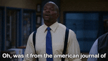 a man in a yellow shirt and blue tie is saying oh was it from the american journal of