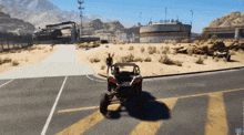 a buggy is driving down a road with mountains in the background