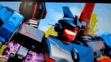 a close up of a robot with red and blue lights on