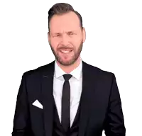 a man in a suit and tie is wearing gloves