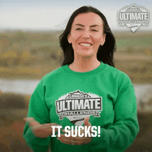 a woman wearing a green shirt that says ultimate challenge