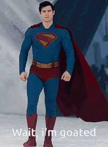 a man in a superman costume is standing in the snow