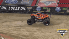 a monster jam truck is driving down a track
