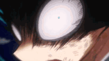 a close up of a person 's eye with a blue circle in it