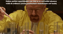 a man in a yellow jacket is pouring liquid into glasses