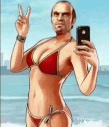 a man in a red bikini is taking a selfie on the beach .