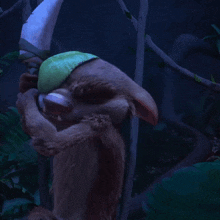 a cartoon character with horns and a green leaf on his head