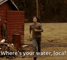 a man running in a field with the words " where 's your water loca " below him