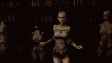 a woman is dancing in a dark room with a bunch of mannequins behind her .