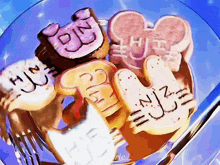 a close up of a plate of cookies with the word pin written on them