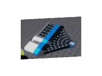 a black and white item with a blue stripe on it is sitting on top of a gray surface .