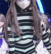 a girl with long hair is wearing a striped shirt and a hat .