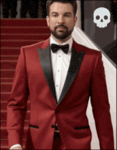 a man in a red tuxedo with a bow tie