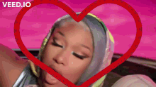 a woman is surrounded by a heart with the word veed.io at the bottom