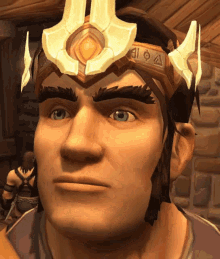 a close up of a man 's face with a crown on his head with the letter a on it
