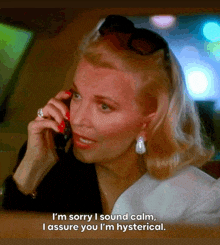 a woman is talking on a cell phone and says " i 'm sorry i sound calm