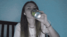 a woman with long hair is wearing a white t-shirt that says ' i love you ' on it .