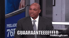 a man in a suit and tie is saying guaaranteeeed