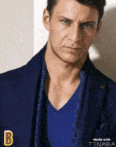 a man wearing a blue jacket and a blue v-neck t-shirt is made with tenada