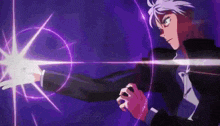 a man in a black suit is holding a purple object in his hand .