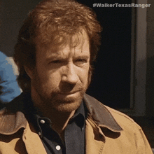 a close up of a man 's face with the hashtag #walkertexasranger visible